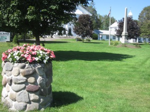 The stone planter on the Green used to be filled with spring-fed water to quench the thirst of oxen and horses after they climbed the hill on Main Street coming from Thomaston.